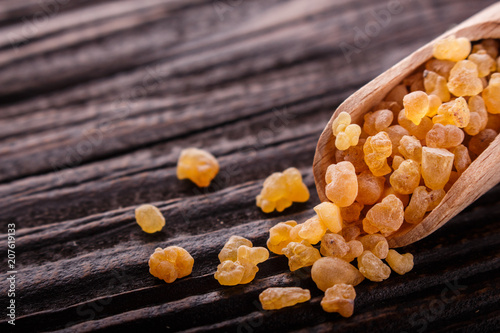 Tela frankincense essential oil on a wooden background