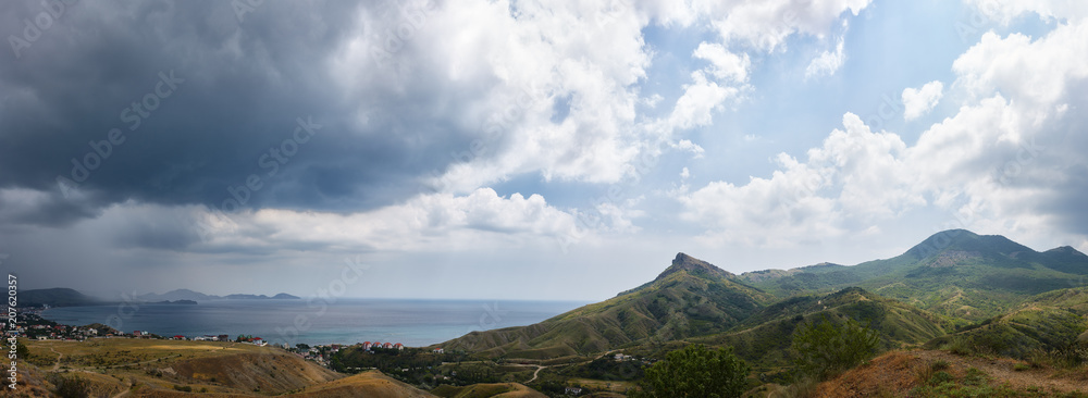 A huge panorama of the city of Koktebel in the Crimea and its surroundings of Mount Karadag and Cape Chameleon.