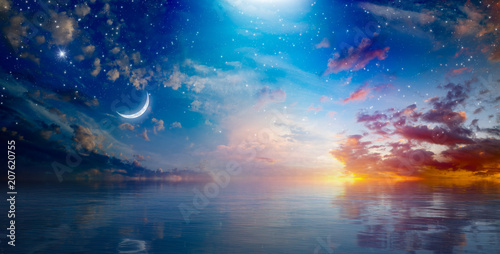 Amazing surreal background - crescent moon rising above serene sea