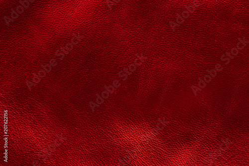 Glowing metallic red leather texture background. small grain