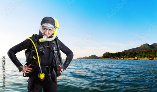 Female diver sportsman in wetsuit and diving gear