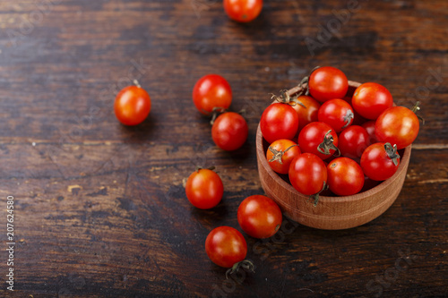 cherry tomatoes on a wooden background