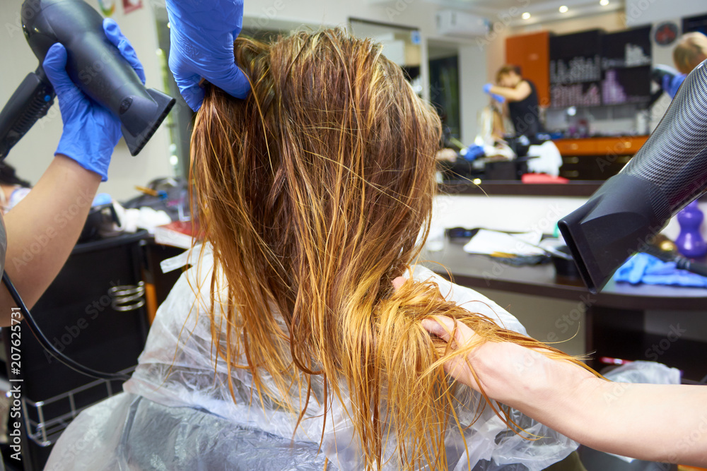 The process of drying female hair The process of drying female hair