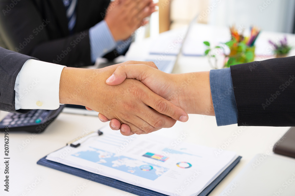 Business people shaking hands successful deal after great meeting.Business partnership handshake concept. Business people shaking hands successful deal after great meeting.Business partnership handshake concept.