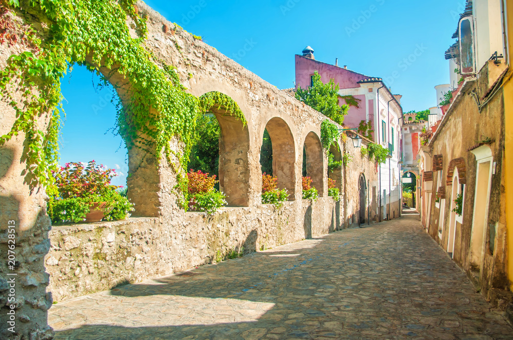old european street with stone wall