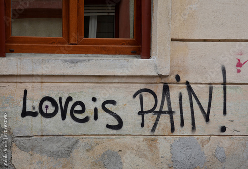 Building architecture in Brasov, Romania with "Love is pain ".