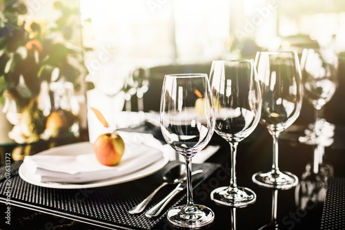 fancy table setting with wine glasses at a elegant restaurant