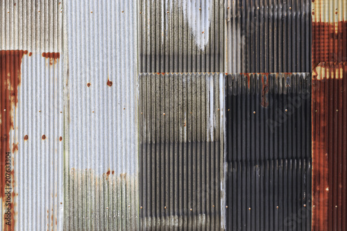 The old rusty zinc fence with screw