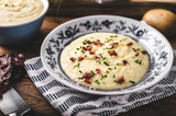 Mashed potatoes, fresh herb and crispy bacon in