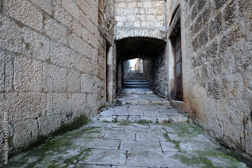 Narrow street in the old town of Korcula, Dalmatia, Croatia  photo