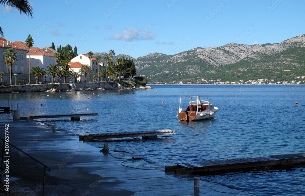 Fototapeta premium Seafront view at picturesque medieval Dalmatian town Korcula, Croatian culture and historic destination.