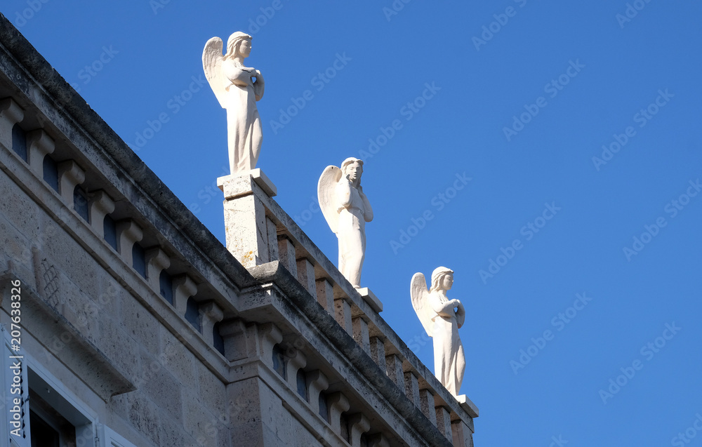 Statue of angel in Korcula, Croatia. Korcula is a historic fortified town on the island of Korcula.