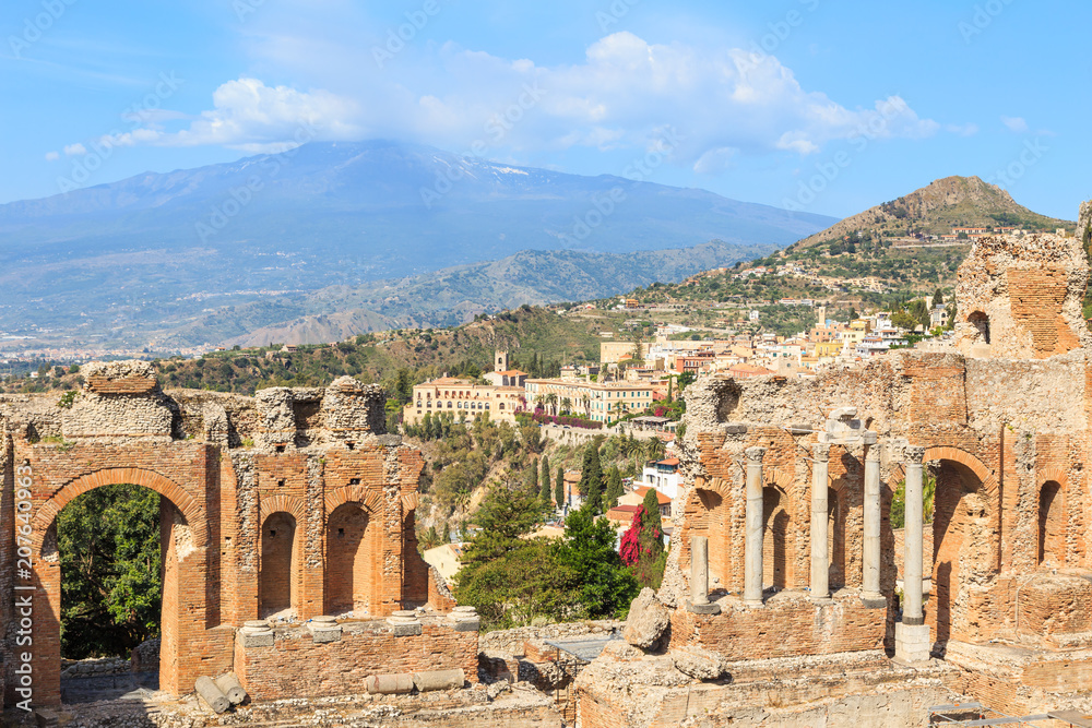 Ancient Theatre of Taormina in Sicily, Italy. In  background, a view of  Mount Etna