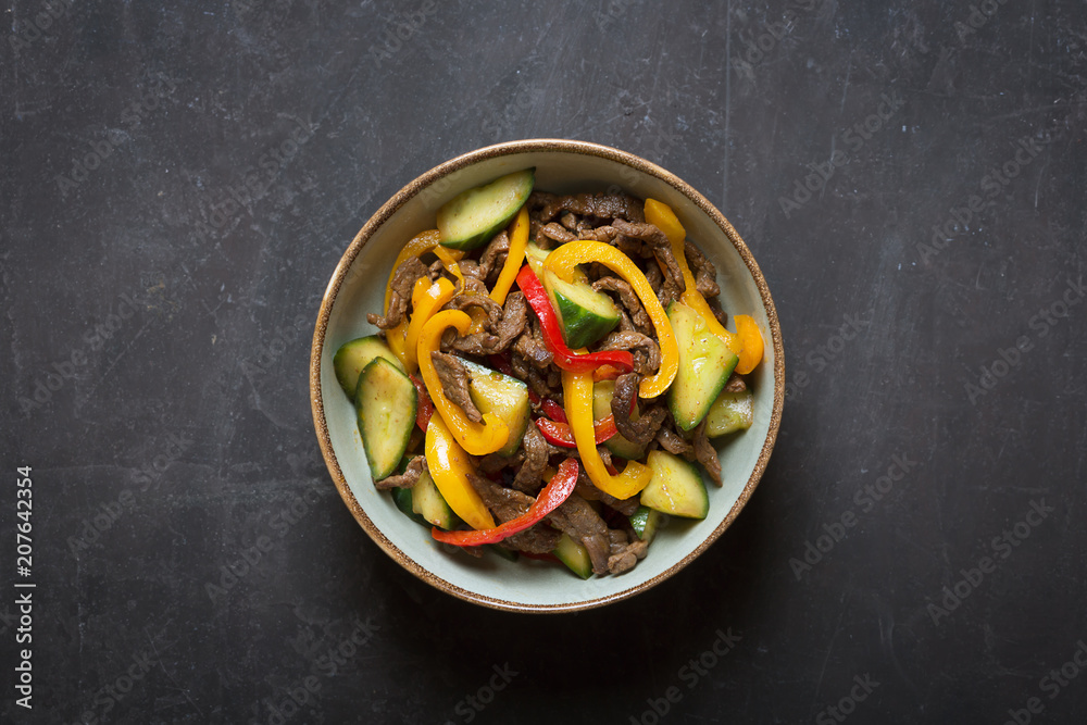 Traditional asian salad prepared with meat,onions and bell pepper. Top view Traditional asian salad prepared with meat,onions and bell pepper. Top view