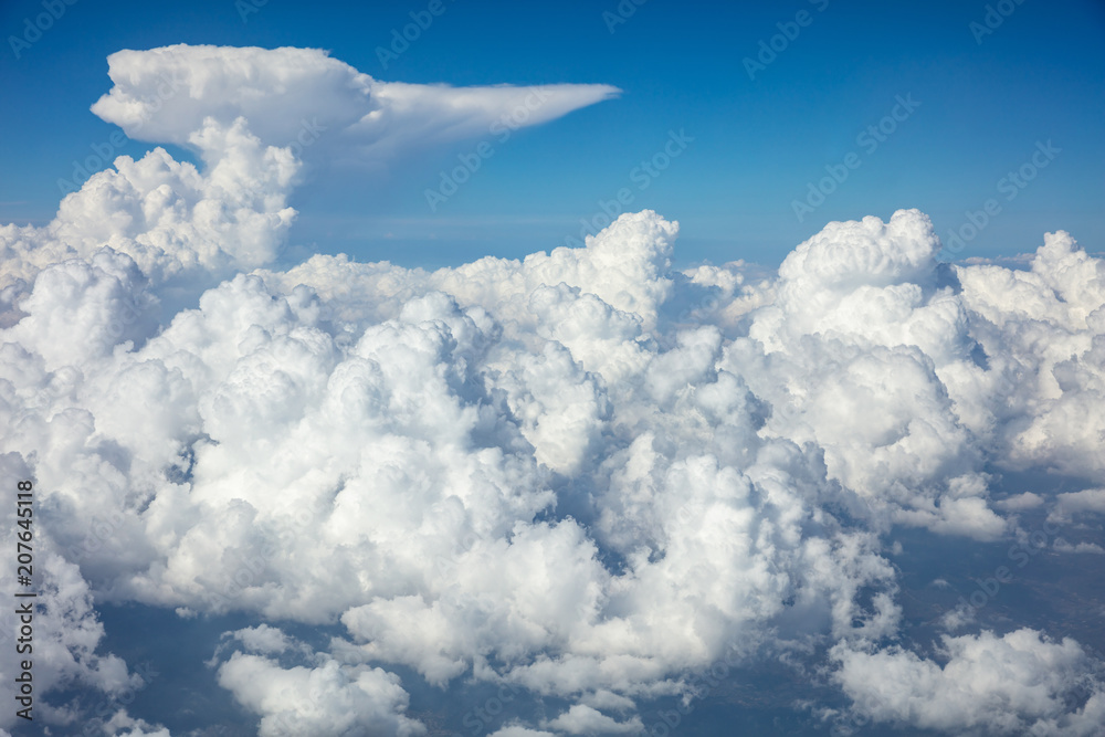 Cloudy sky background. View out of an airplane window. Cloudy sky background. View out of an airplane window.