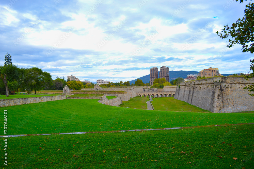 Green park with city walls (city citadel) of Pamplona, Spain.