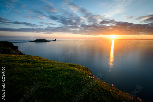 Sunset at Rhossili Bay - Rhossili Bay has been voted Wales' Best Beach many times. It is located on the west coast of Gower Peninsular photo