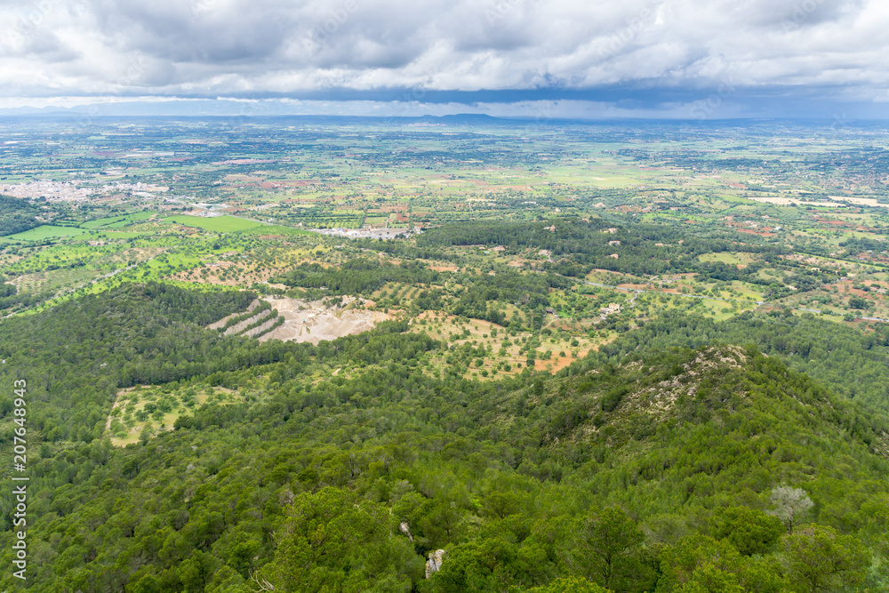 Mallorca, Aerial view on green natural spanish fields and forest landscape from above