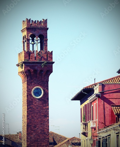 bell tower on the island of Murano near Venice with vintage effect photo