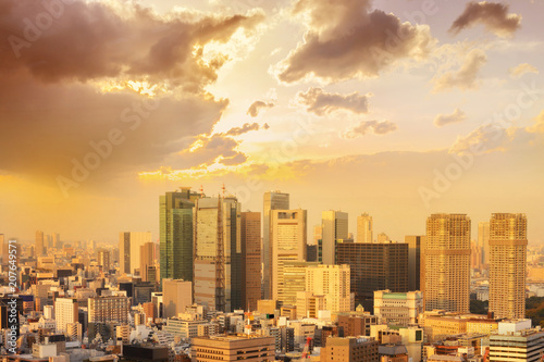 cityscape of tokyo city sunset /sunrise skyline in Aerial view with skyscraper, modern business office building with blue sky background in Tokyo metropolis city, Japan.
