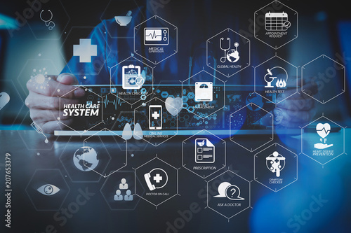 medical techonlogy concept,smart doctor hand working with modern laptop computer in modern office with virtual icon diagram