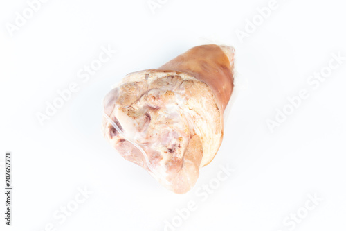A raw pork hock wrapped by plastic.