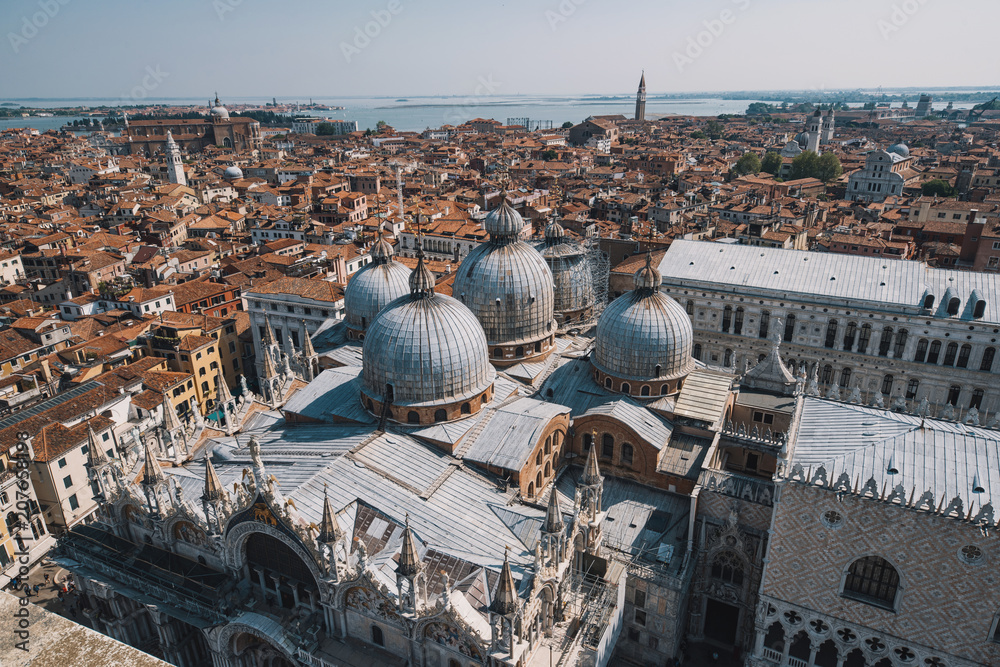 Fototapeta premium Venice view from above - domes of Saint Mark's Basilica and ancient architecture.