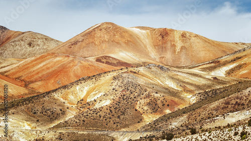 Volcanic multicolored mountains, near the town of Cariquima and Colchane, in the Tarapaca region, Chile photo