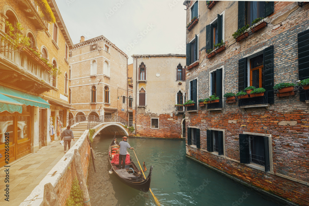 Canal with gondolas in Venice, Italy.