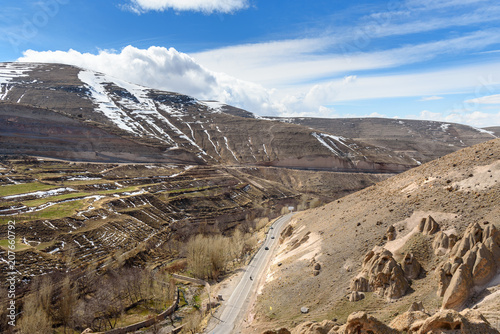 View of mountain landscapes and road to rock village Kandovan. Iran