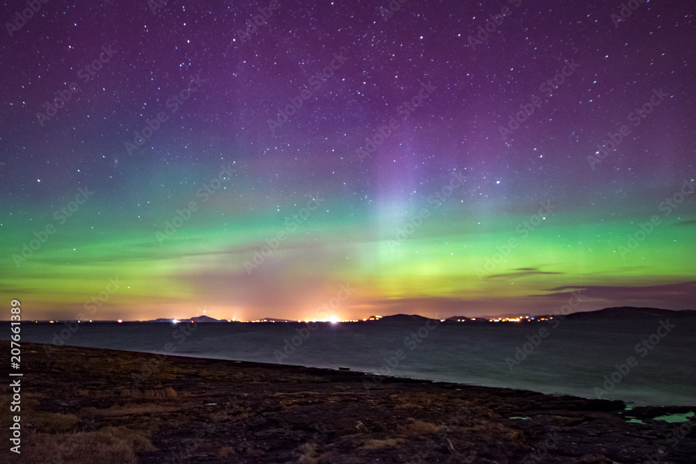 Northern lights aurora at seaside color Norway