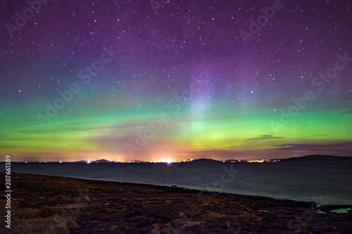 Northern lights aurora at seaside color Norway