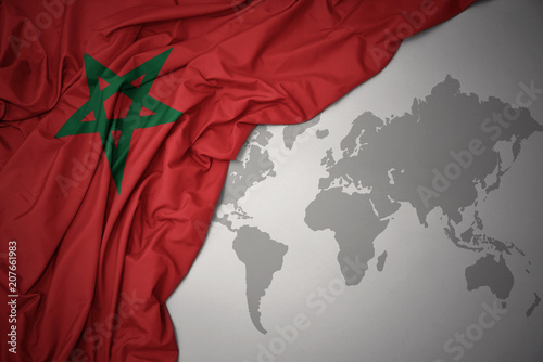 Valokuva waving colorful national flag of morocco.