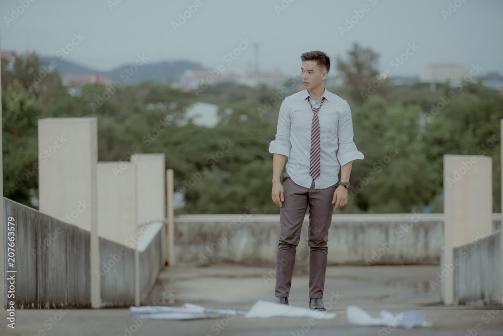 Concept of business failure and unemployment problem.An unemployed businessman sits alone in the corridor of an office. Is stressed about the future. Concept of business failure and unemployment problem.An unemployed businessman sits alone in the corridor of an office. Is stressed about the future.