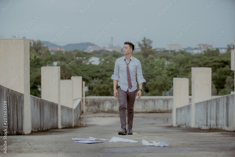 Concept of business failure and unemployment problem.An unemployed businessman sits alone in the corridor of an office. Is stressed about the future. Concept of business failure and unemployment problem.An unemployed businessman sits alone in the corridor of an office. Is stressed about the future.
