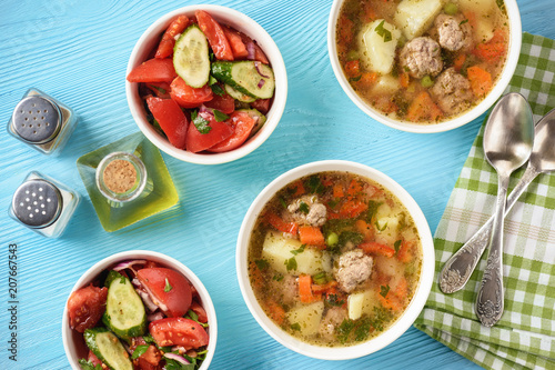 Vegetable soup with meatballs and tomato salad.