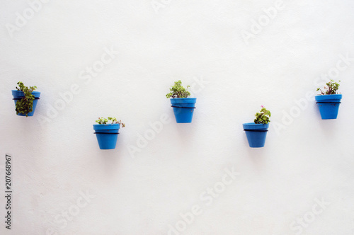 Blue flowerpots in Spain