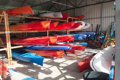 Obraz na plátně Storage of kayaks and boats in hangar