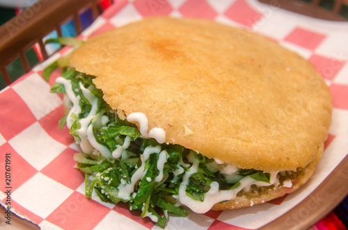 Typical mexican antojito served in a clay dish photo