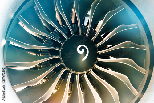 Close up of turbojet of aircraft turbine engine fan civil with a gradient of colors from cold to warm. photo