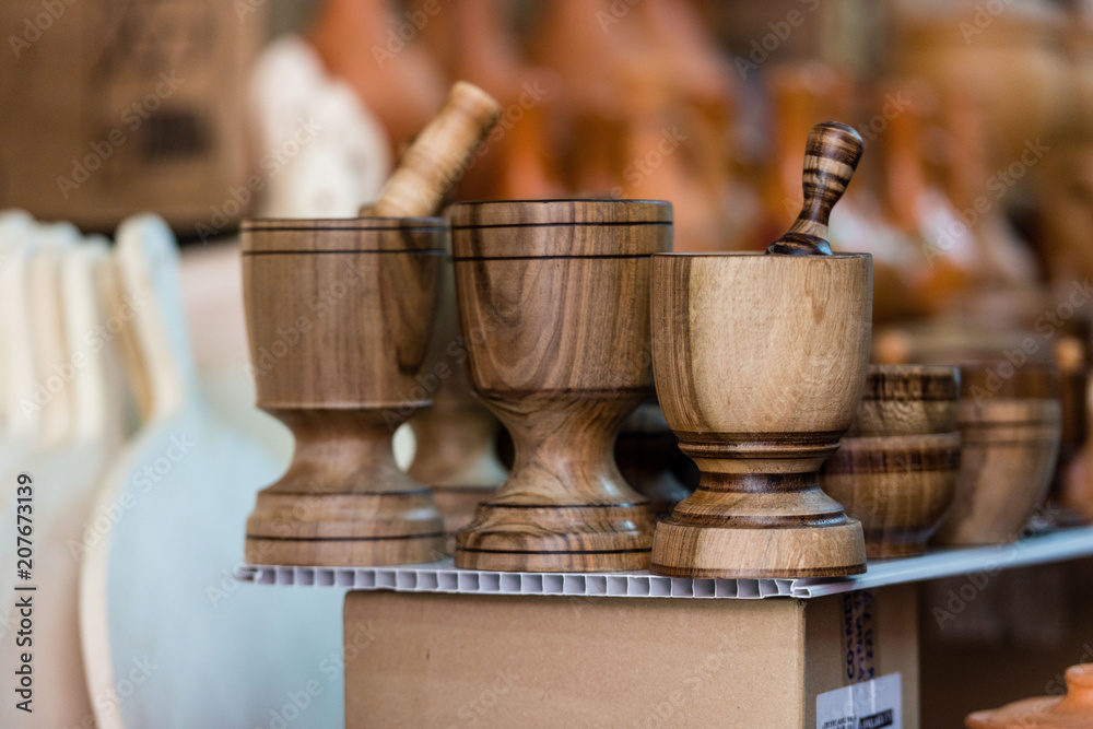 Fototapeta premium Various wooden products in the souvenir shop window.