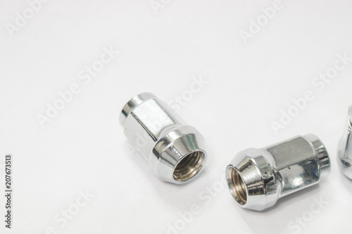 Car service, nut of fixture of a wheel of the car on a white background,