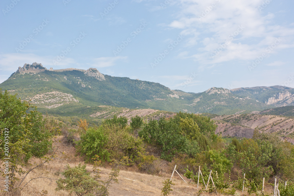 Views of the famous mountain Demerdzhi with the track. Demerdzhi is a landmark of Crimea