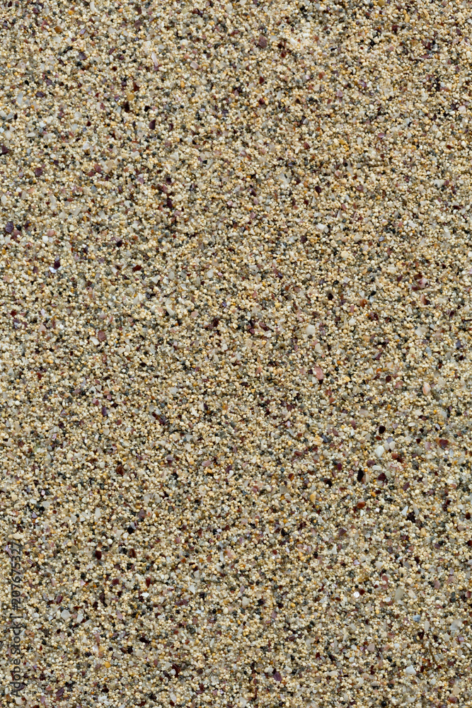 Sea sand, smooth background. Small pellets. Vertical Sea sand, smooth background. Small pellets. Vertical