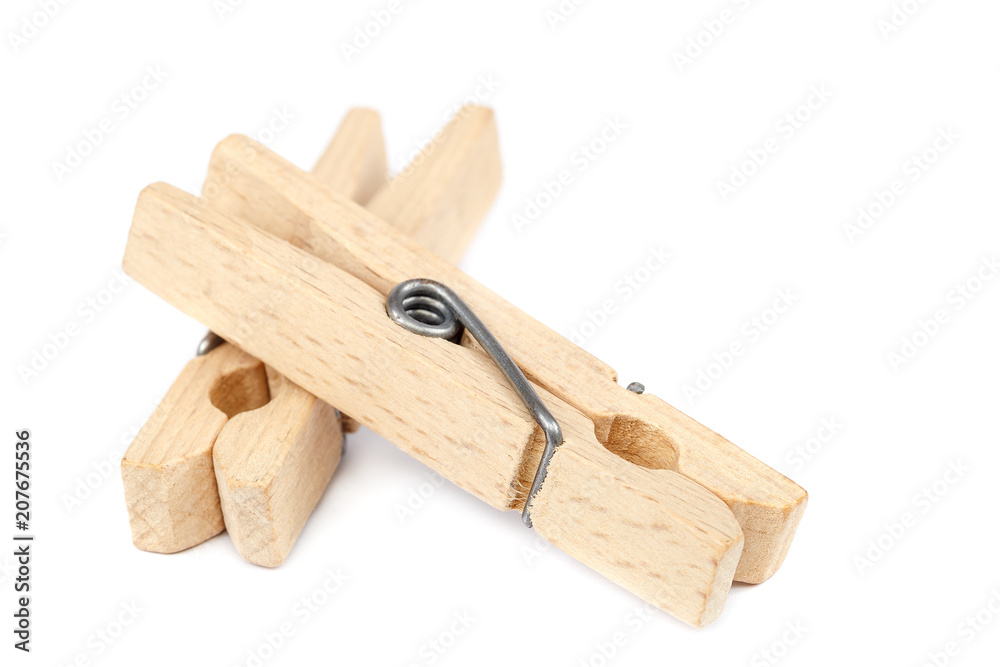 Wooden clothespins isolated on a white background. Wooden clothespins isolated on a white background.