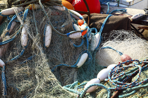 Sea fishing nets drying on a boat at filey bay england UK photo