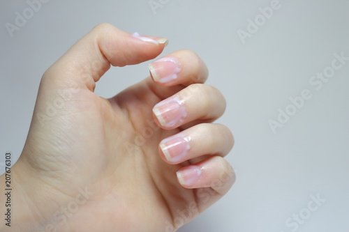 Female hands and nails are done. Long nails might be unsafe and carry on bacterias. Short nails are healthier 