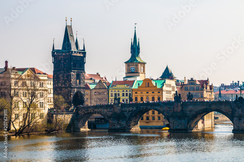 Charles Bridge with tourists and Vltava river in Prague. Famous landmark of Czech Republic