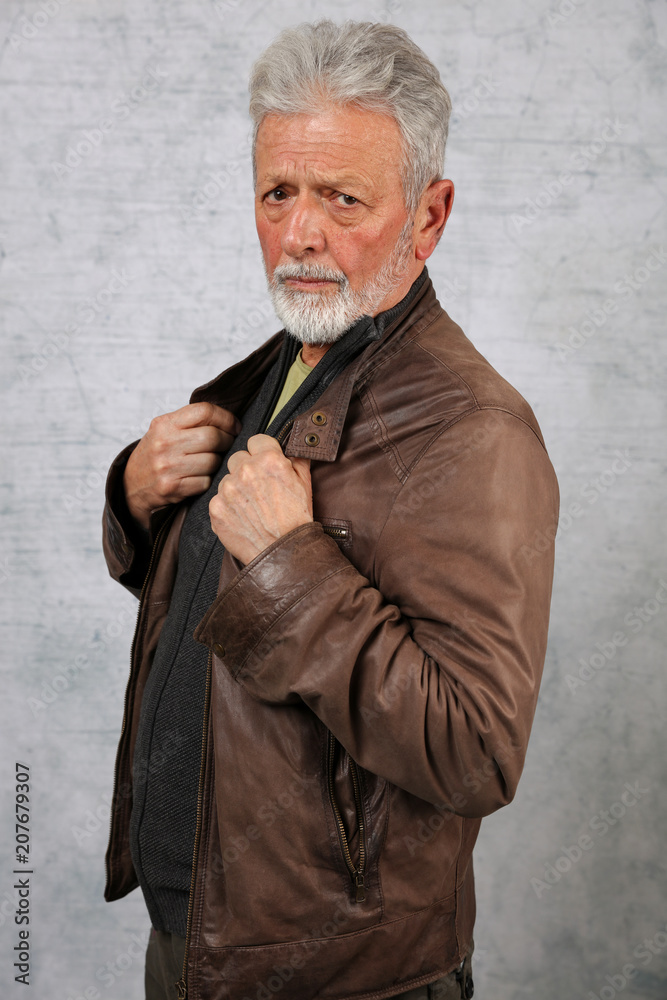 Portrait of stylish senior bearded man wearing leather jacket. Fashion , lifestyle concept