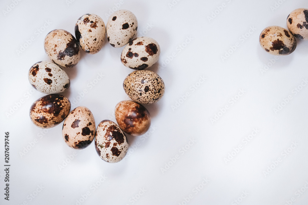 Fresh quail eggs on white background